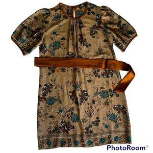 Unique satin dress with belt. Floral print on gold background. ADL size Large.